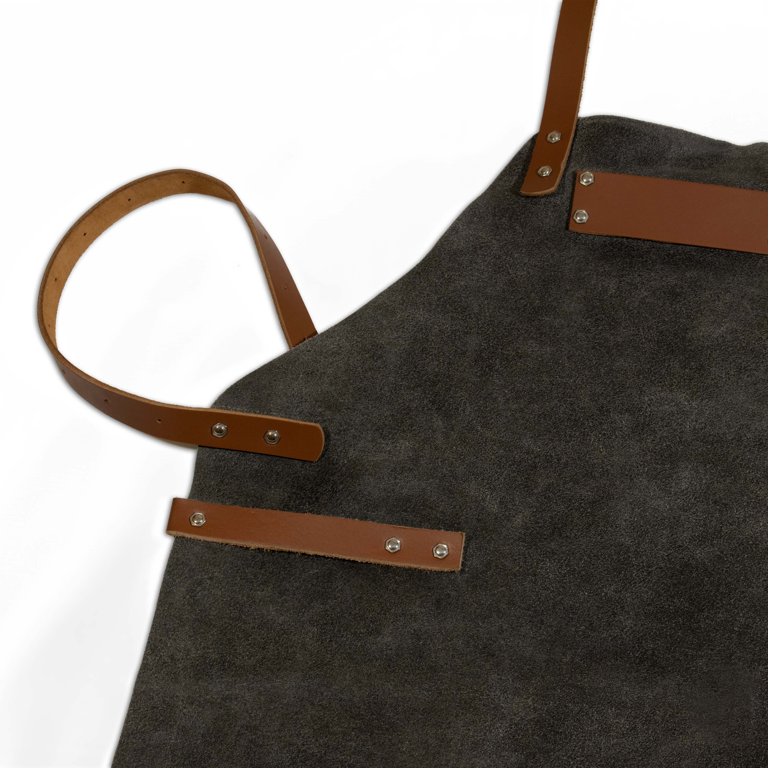 Side buckle and D-ring hardware on grey suede leather work apron